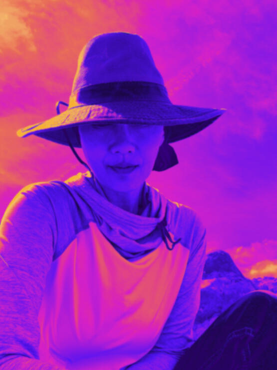 The sky and Ana wearing a hat.